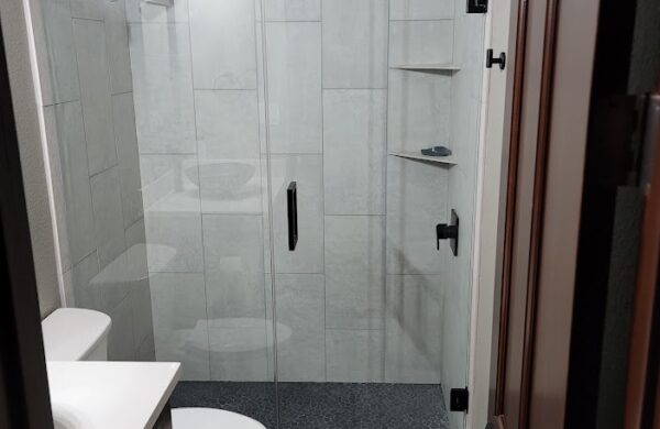 Glass shower with rock floor feature