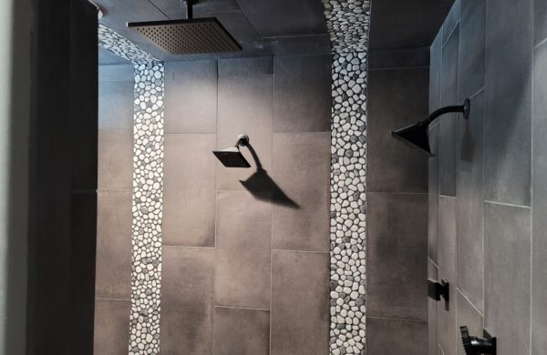 Shower with rock and tile features